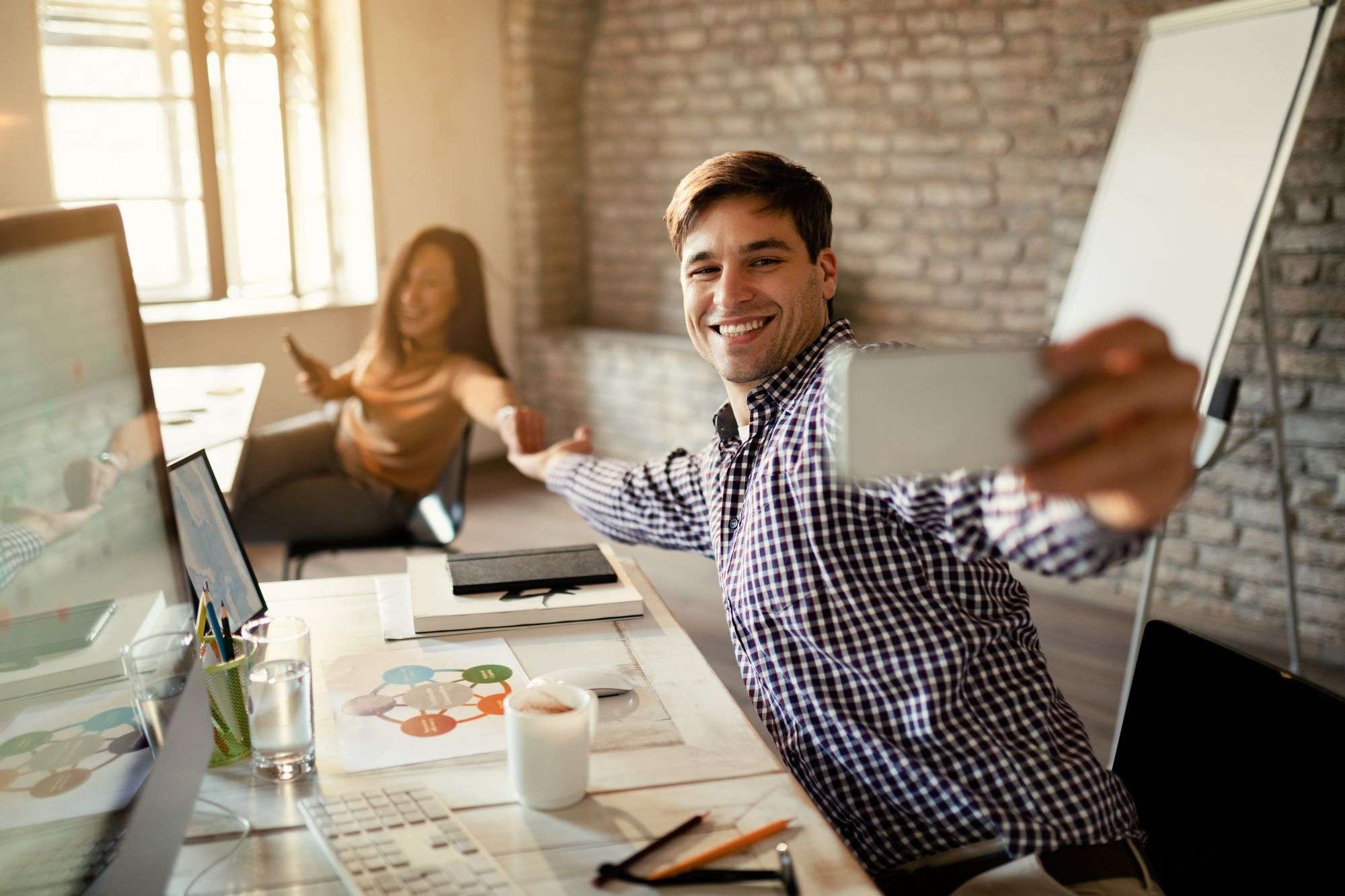 happy freelancers having fun while taking selfie